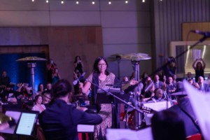 Germaine Franco conducting at the Music Masquerade Gala